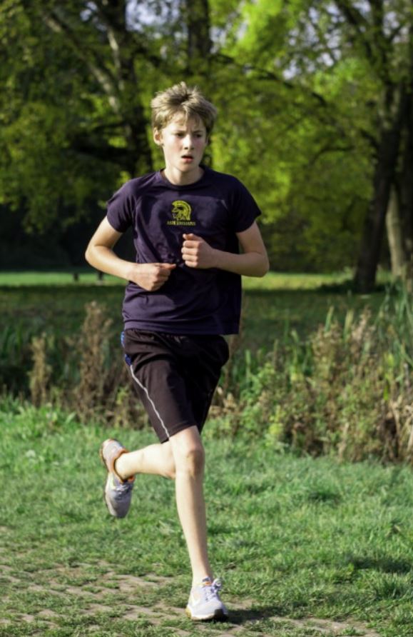 A photo of a boy jogging